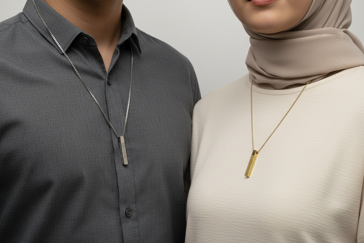 Couple facing forward with necklaces closer